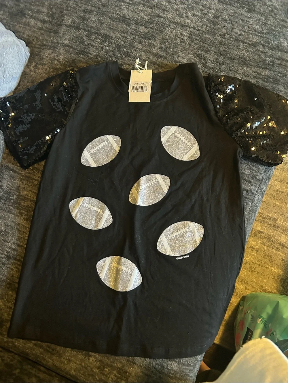 Black Sequin-Sleeve Football Graphic Tee and Jeans. Cute outfit.